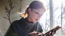 Woman shopping online with mobile phone and credit card